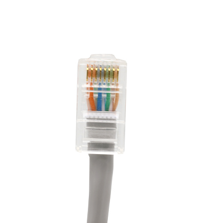 Gray network cables with molded RJ45 plug isolated on white background