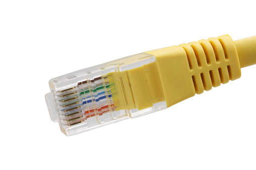 Yellow network cables with molded RJ45 plug isolated on white background