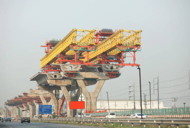 Machinery for placing precast segments over columns for the deck of elevated road.