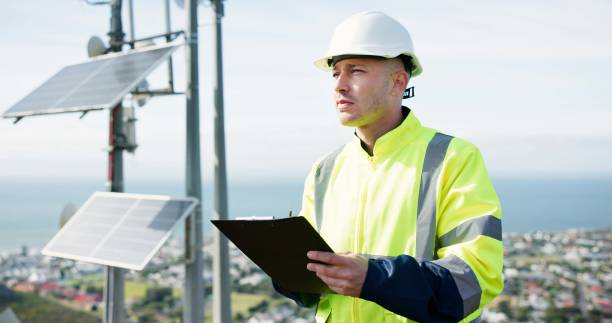 istock Man, writing and engineer for solar panel inspection, quality check or alternative energy maintenance on rooftop. Male person, contractor or technician on clipboard for photovoltaic checklist in city 2149701398