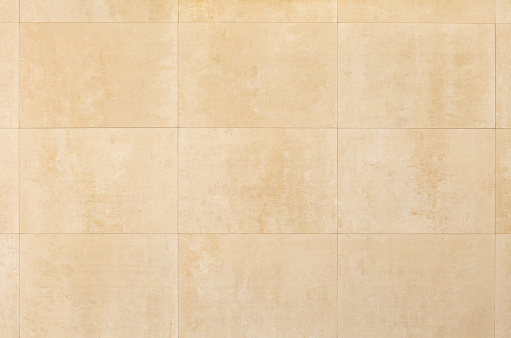 Wall of flat, rectangular blocks of light yellow Sandstone or shell rock. Background image, texture