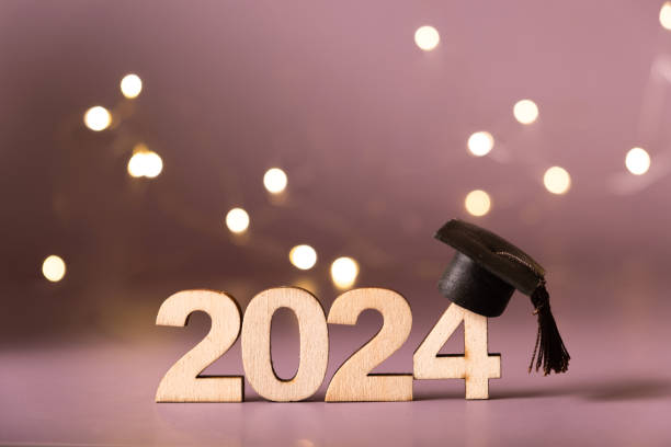 istock Number 2024 with graduated cap and bokeh lights. Class of 2024 concept 2149701537
