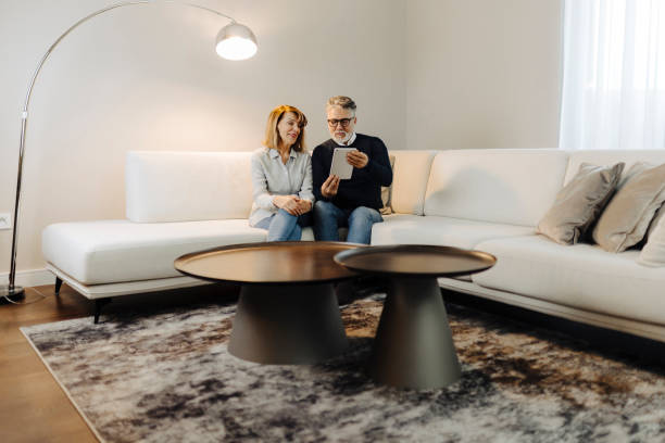 istock Senior couple using digital tablet at home 2149701639
