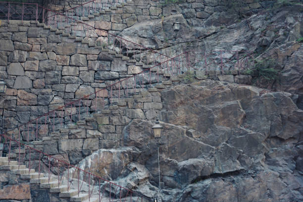 a stone staircase leads up by the mountain