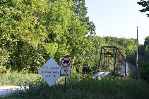 William's Bend Bridge, aka Rough Holler Bridge, is a historic steel truss bridge with wooden flooring, spanning the Pomme de Terre river near Hermitage, MO, United States, US. It was built in 1890.