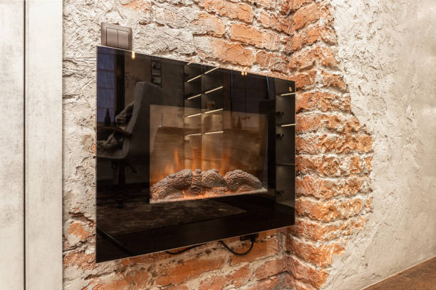 istock Interior with a wall-mounted electric fireplace against a brick and plastered wall. 2149704456