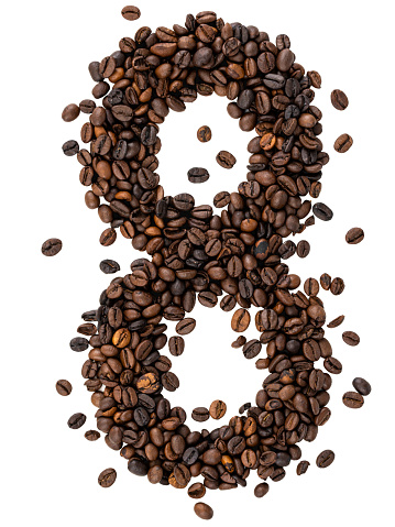 Number eight made from coffee beans scattered on a white background. Top view. Caffeine typeface.