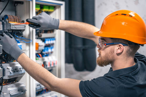 istock Male electrician working in a switchboard with fuses. 2149705031