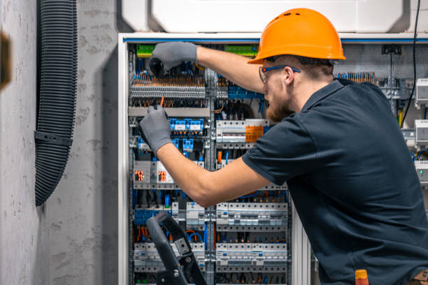 istock Male electrician working in a switchboard with fuses. 2149705286