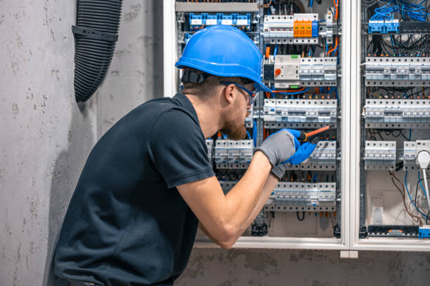 istock A male electrician works in a switchboard with an electrical connecting cable. 2149705290