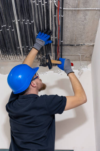 istock Electrician installing laying electrical cables on the ceiling inside the house. 2149705305