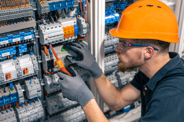 istock Male electrician working in a switchboard with fuses. 2149705308