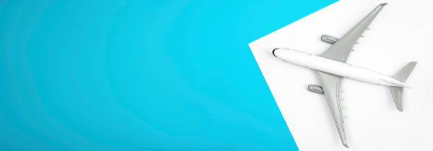 istock Airplane on a blue and white background, flat lay, travel concept. 2149705569