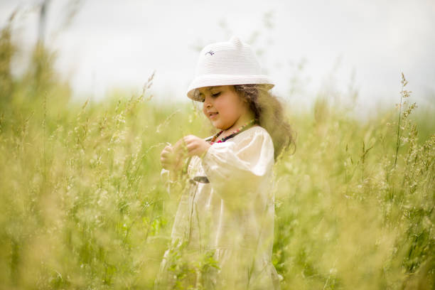 istock little girl playing in the park 2149705755