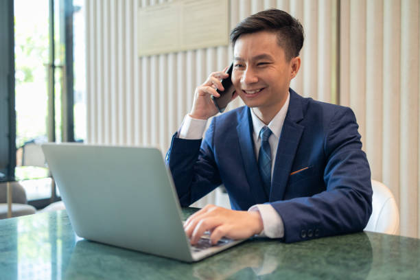 istock Cheerful Businessman Working on Laptop in Office 2149705896