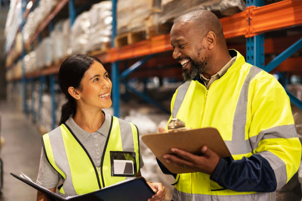 istock Happy people, warehouse and inventory inspection with clipboard for checklist or storage management. Man, woman or team with smile for stock check in export, import or shipping industry at depot 2149706232