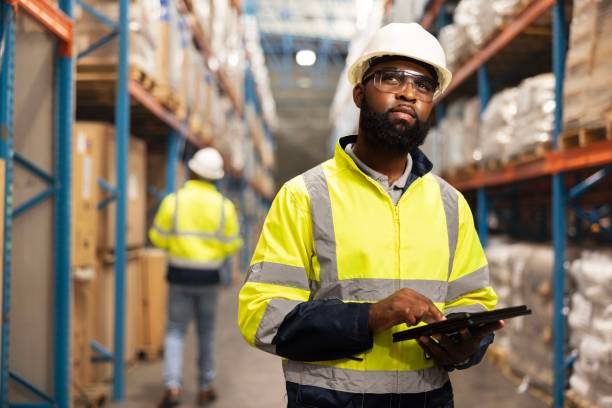 istock Logistics, warehouse and black man with tablet for checklist, inventory and stock distribution. Male person, technology and storehouse with planning for maintenance, inspection and ecommerce shipping 2149706249