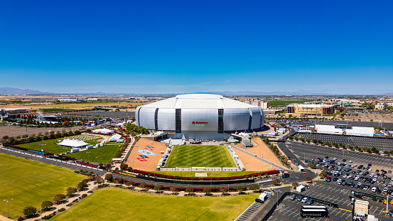 Glendale, AZ - April 7, 2024: State Farm Stadium is a multi-purpose retractable roof stadium in Glendale, Arizona, United States, west of Phoenix. It is the home of the Arizona Cardinals of the National Football League and the annual Fiesta Bowl.