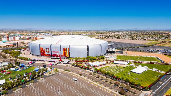 Glendale, AZ - April 7, 2024: State Farm Stadium is a multi-purpose retractable roof stadium in Glendale, Arizona, United States, west of Phoenix. It is the home of the Arizona Cardinals of the National Football League and the annual Fiesta Bowl.