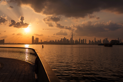 amazing sunset view of Dubai Downtown cityline from Dubai Creek harbour. High quality photo