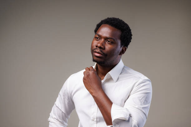 Formal portrait in studio of a young African American man