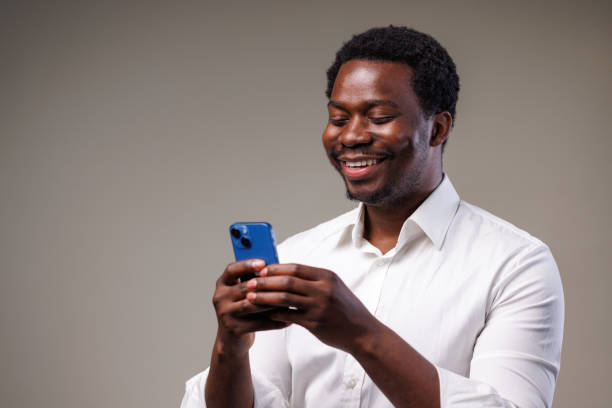 istock Studio shot of a young man using a mobile phone 2149711280