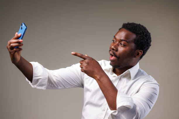 istock Studio shot of African American man taking a selfie 2149711284