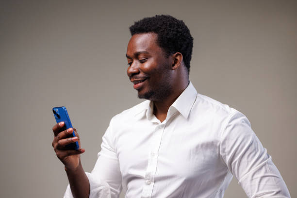 istock Studio shot of a young man using a mobile phone 2149711285