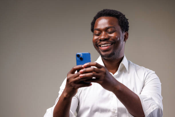 istock Studio shot of a young man using a mobile phone 2149711286