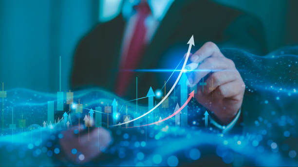 istock Trader use laptop analyzing growing stock on virtual screen for invest in trading. 2149711565