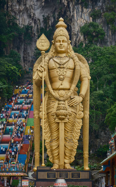 Entrance to Batu Caves and the Murugan statue  (The Hindu god of war )also known as Kartikeya , Skanda, Subrahmanya and Shanmukha .Gombak, Selangor Malaysia