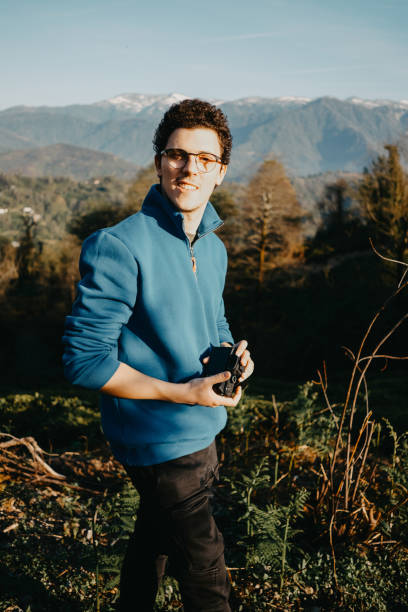 istock Young man taking pictures in nature 2149712067