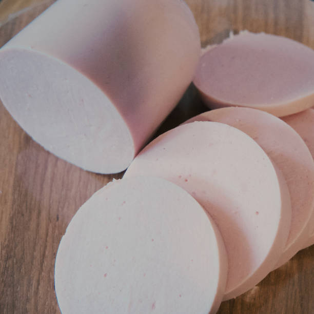 istock Boiled sausage cut into pieces, a close-up shot. 2149712283