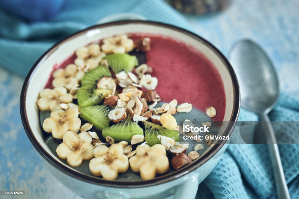 Pitaya Smoothie in Bowl with Kiwi, Banana, Blueberries and Superfoods on Top Quinoa Stock Photo Pitaya Smoothie in Bowl with Kiwi, Banana, Blueberries and Superfoods on Top Quinoa Stock Photo