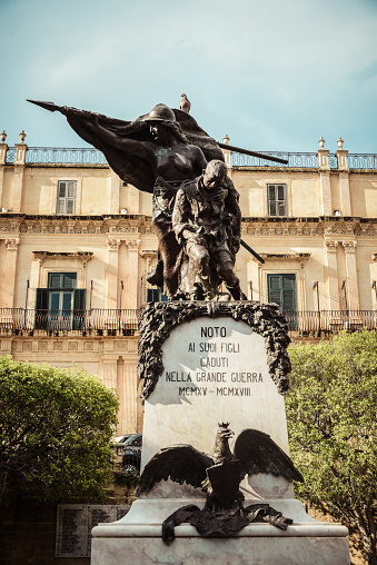 Low Angle View Of Monumento ai Caduti nella Grande Guerra And Palazzo Landolina In Noto, Sicily
