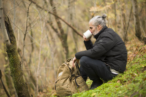 istock A mountaineer man walking in the forest in spring 2149712988