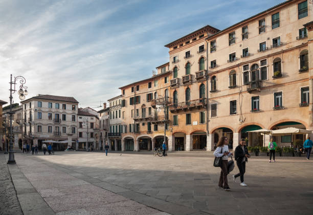 Bassano del Grappa, Italy - 2023, October 17 : People walking on Liberty square in the center of the old town of Bassano del Grappa in the Veneto region of Northern Italy