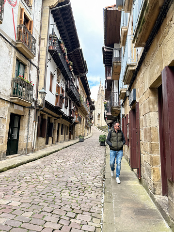 Man walking down the street of Hondarribia