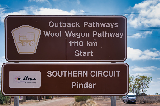 Pindar, Australia, 11/15/2023. Sign with logo at the start of the Wool Wagon Pathway, from inland Pindar to coastal Exmouth, via unpaved roads through the outback.