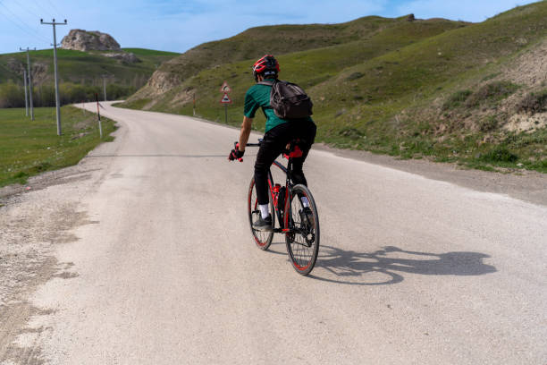 Athlete cycling outdoors. Doing sports in nature.