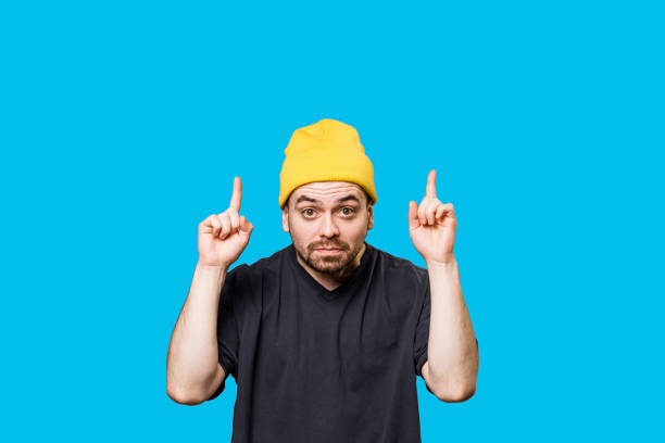istock Pointing to Free Space, Bizarre Grimace and Looking at Camera People, Caucasian Man, Studio Portrait 2149721600