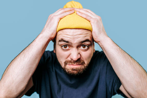 istock This close-up studio portrait captures an angry man staring directly at the camera 2149721607