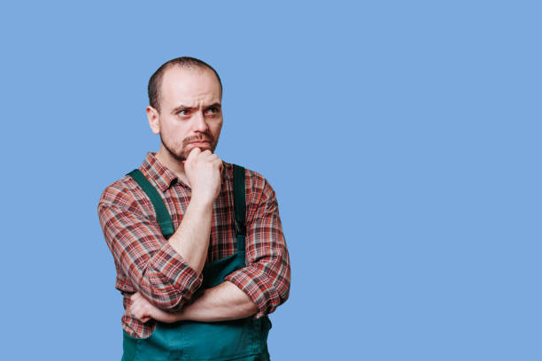 istock portrait of a serious and pensive bearded young workman 2149721661
