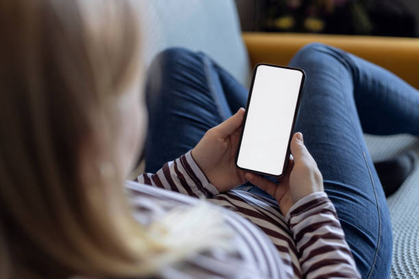 istock Woman using smartphone in cafe with coffee 2149722344