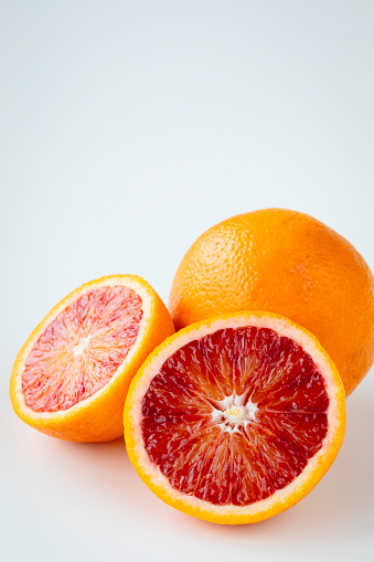 Blood orange slices on white background