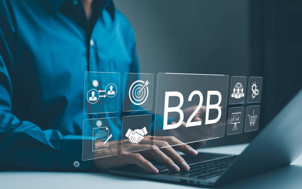 istock B2B business strategy concept. Businessman working with a B2B virtual interface on a laptop, conceptualizing strategy, partnership, targets in business to business services. E-commerce, B2B Marketing 2149728297