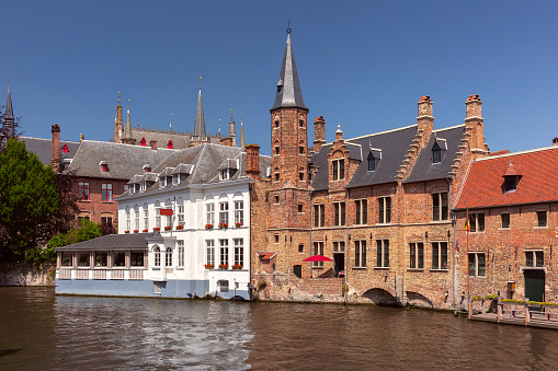 Scenic sunny medieval fairytale town from the quay Rosary in Bruges, Belgium