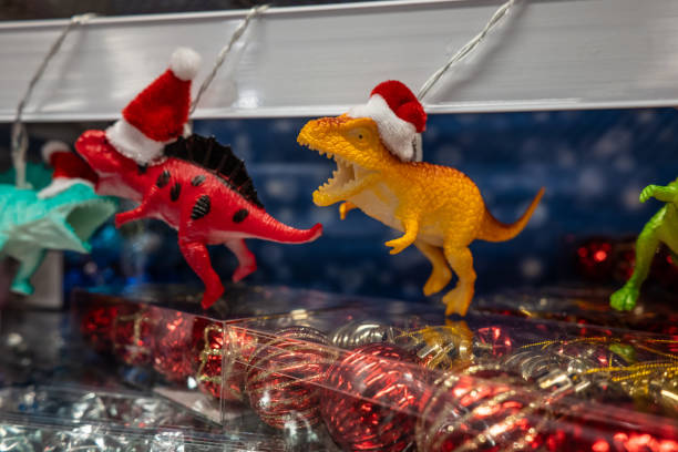 istock Toy dinosaurs with christmas theme in a shop. 2149729679
