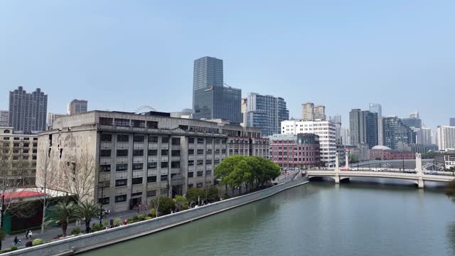 Shanghai city on sunny day, modern buildings in downtown area, high angle view of Suzhou River in Shanghai.