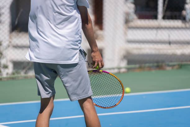 istock Young Tennis Player Preparing to Serve 2149732888